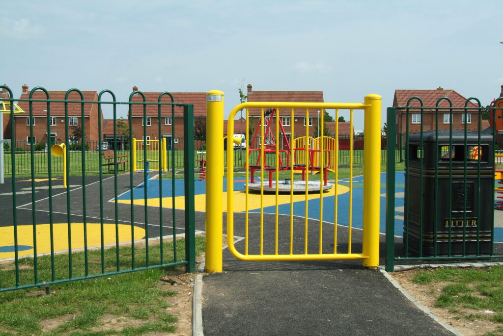 A mono hinge self closing gate, powder coated yellow